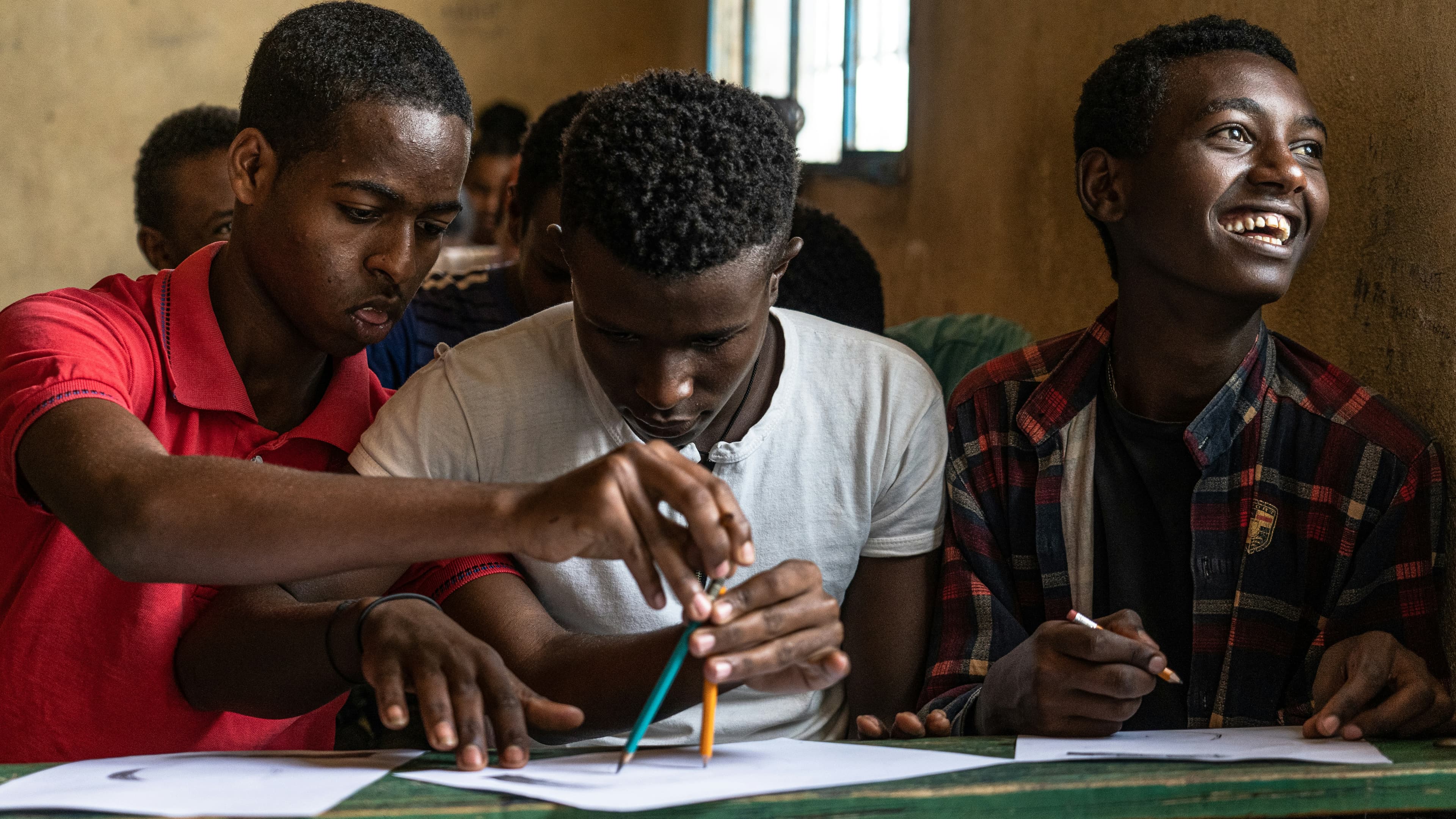 Students learning together in a classroom setting